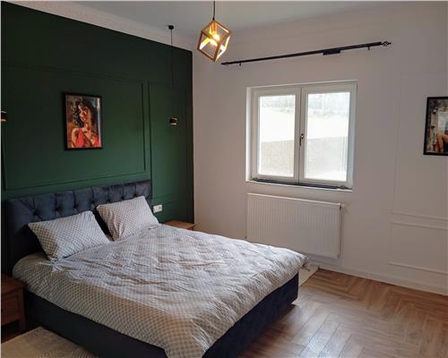 Casa mobilata 120 mpu 4 camere 2 bai cu teren 500 mp 10 min de Sibiu