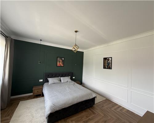 Casa mobilata 120 mpu 4 camere 2 bai cu teren 500 mp 10 min de Sibiu
