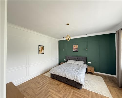 Casa mobilata 120 mpu 4 camere 2 bai cu teren 500 mp 10 min de Sibiu